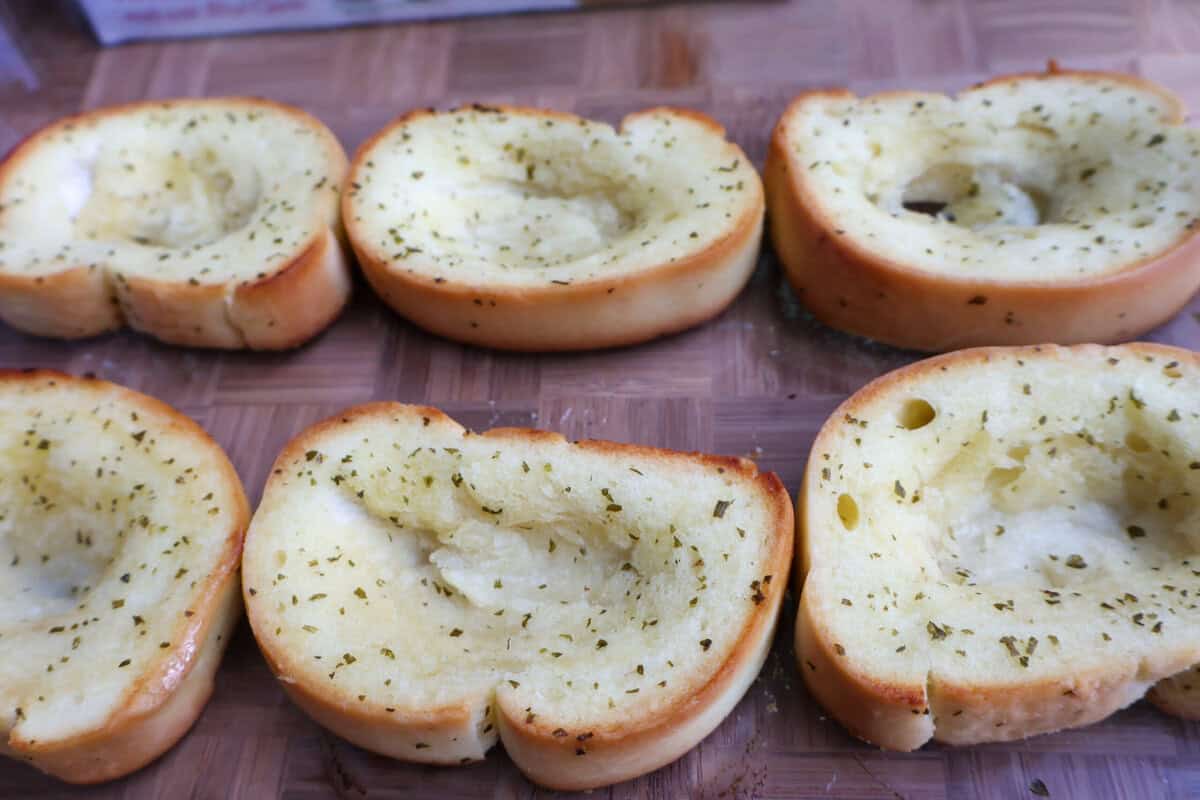 A shallow well pressed into a slice of toasted Texas Toast to hold the filling