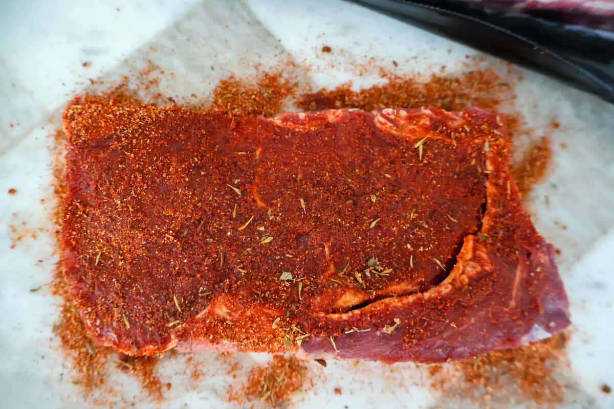 Ribeye steak seasoned with blackened seasoning for surf and turf pasta