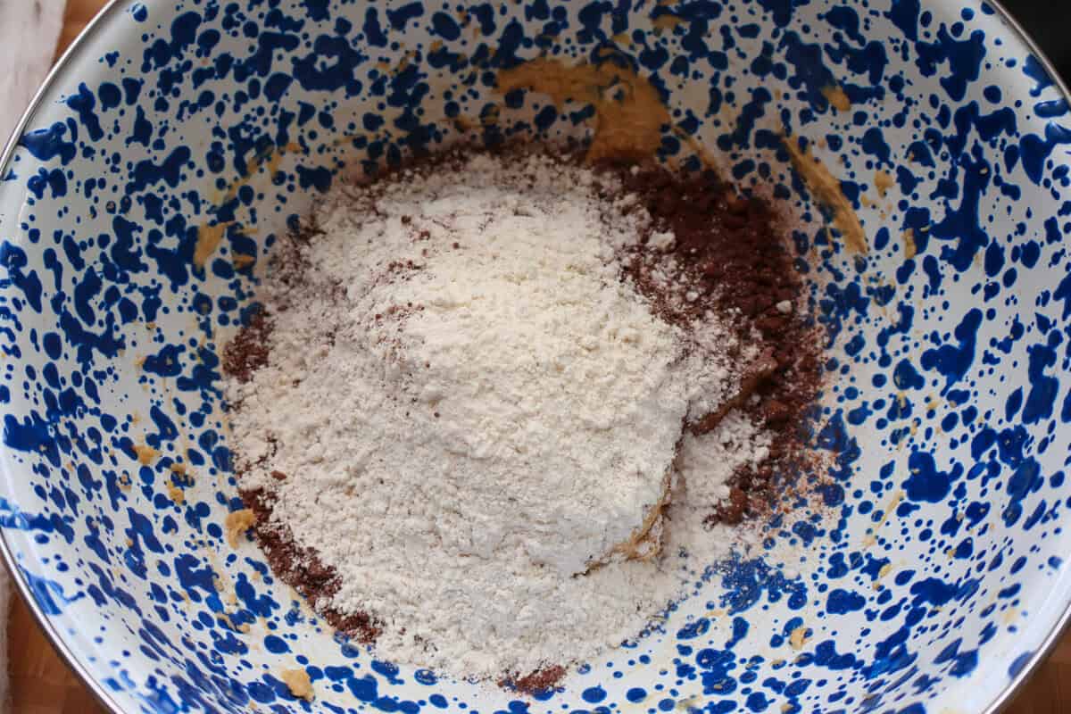 Gluten-free flour and cocoa powder added to the wet ingredients for spider web cookies